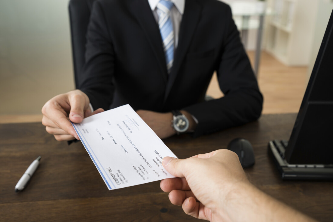 Handing Over Check